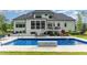 A private pool and patio, complemented by the home's architecture and landscaping, creates an outdoor retreat at 8017 Discovery Falls Trl, Wake Forest, NC 27587