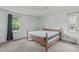 Bedroom featuring carpet floors and natural light from two windows at 9108 Ransdell Rd, Raleigh, NC 27603