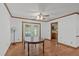 Spacious dining room featuring wood floors and a ceiling fan for a comfortable atmosphere at 9108 Ransdell Rd, Raleigh, NC 27603