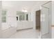 Bathroom with double vanity, tub and glass enclosed shower at 9251 Palm Bay Cir, Raleigh, NC 27617