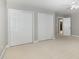 Spacious bedroom with neutral carpet, two large closets, and ceiling fan with lights at 9251 Palm Bay Cir, Raleigh, NC 27617