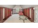 Large walk-in closet with custom built-ins and seating area at 9251 Palm Bay Cir, Raleigh, NC 27617