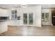Open concept kitchen with stainless steel appliances, leading to a dining area with access to the patio at 9251 Palm Bay Cir, Raleigh, NC 27617