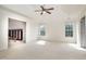 Spacious primary bedroom with two large windows, ensuite bathroom, and walk-in closet at 9251 Palm Bay Cir, Raleigh, NC 27617