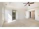 Bright primary bedroom with ceiling fan, lots of windows and ensuite bathroom access at 9251 Palm Bay Cir, Raleigh, NC 27617