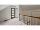 Attic space featuring a unique door and a railing at 1000 Lamond Ave, Durham, NC 27701