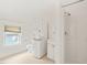 Bathroom featuring a washer/dryer stack, toilet, and shower stall at 1000 Lamond Ave, Durham, NC 27701