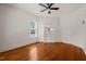 Bedroom with hardwood floors, a ceiling fan, and a decorative fireplace with a mirror at 1000 Lamond Ave, Durham, NC 27701