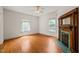 Bedroom with hardwood floors, a decorative fireplace, and stained glass in the window at 1000 Lamond Ave, Durham, NC 27701
