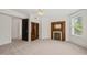 Bedroom featuring a ceiling fan, fireplace and access to closet/bathroom at 1000 Lamond Ave, Durham, NC 27701