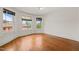 Spacious bedroom featuring hardwood floors, and multiple windows at 1000 Lamond Ave, Durham, NC 27701