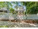 Charming two-story home with a white picket fence and a beautifully landscaped front yard at 1000 Lamond Ave, Durham, NC 27701