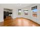 Open living room with hardwood floors and a view of the kitchen through the doorway at 1000 Lamond Ave, Durham, NC 27701