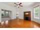 Inviting living room area with hardwood floors, a decorative fireplace, and multiple doorways at 1000 Lamond Ave, Durham, NC 27701