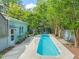 In-ground pool with an adjacent spa in a landscaped backyard at 1000 Lamond Ave, Durham, NC 27701