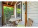 Cozy outdoor porch area with seating and views of greenery at 1000 Lamond Ave, Durham, NC 27701