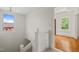 Bright stairway with white walls and banister lead to hardwood floors of adjacent living space at 1000 Lamond Ave, Durham, NC 27701