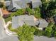 Aerial view of a house featuring mature landscaping and connecting brick patios at 10003 Fountain, Chapel Hill, NC 27517