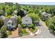 Aerial view of a charming home nestled in a lush neighborhood with mature trees at 10003 Fountain, Chapel Hill, NC 27517