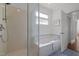 Bathroom featuring shower, tub, window, and tiled flooring at 10003 Fountain, Chapel Hill, NC 27517