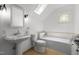 Bathroom featuring bathtub, sink, toilet, window, and tiled flooring at 10003 Fountain, Chapel Hill, NC 27517