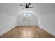 Spacious bedroom featuring hardwood floors, ceiling fan, and window at 10003 Fountain, Chapel Hill, NC 27517