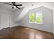 Bedroom with a ceiling fan, hardwood floors, and a window providing natural light at 10003 Fountain, Chapel Hill, NC 27517