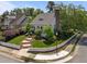 Beautifully landscaped corner lot with a white picket fence surrounding a classic white home at 10003 Fountain, Chapel Hill, NC 27517