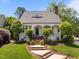 Charming home with a well-manicured lawn and inviting brick steps leading to the front door at 10003 Fountain, Chapel Hill, NC 27517