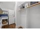Functional laundry area with washer, dryer, sink, and a spacious storage closet at 10003 Fountain, Chapel Hill, NC 27517