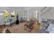 Spacious living room with hardwood floors, stylish seating, and an arched doorway leading to other rooms at 10003 Fountain, Chapel Hill, NC 27517