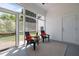 Relaxing screened-in porch with seating and a view of the lush surroundings at 10003 Fountain, Chapel Hill, NC 27517