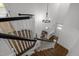 View of staircase with wooden steps and a chandelier at 10003 Fountain, Chapel Hill, NC 27517