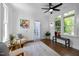 Cozy sunroom with hardwood floors, lots of natural light, and stylish decor at 10003 Fountain, Chapel Hill, NC 27517