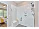 Modern bathroom featuring a glass shower with white tiled walls and a built-in bench at 1021 Greatland Rd, Durham, NC 27703