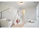 Cozy bedroom with neutral walls, chair, area rug, and a tent at 1021 Greatland Rd, Durham, NC 27703