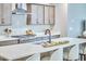 Kitchen island with bar seating offers modern appliances and ample prep space at 1021 Greatland Rd, Durham, NC 27703