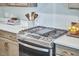Modern kitchen design highlighting the stainless steel stove and ample counter space at 1021 Greatland Rd, Durham, NC 27703