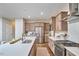 Bright kitchen featuring a large island with bar seating and stainless steel appliances at 1021 Greatland Rd, Durham, NC 27703