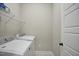 Laundry room features a side-by-side washer and dryer set and wire shelving at 1021 Greatland Rd, Durham, NC 27703