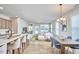 Bright open floor plan with a spacious living room featuring hardwood floors, dining, and kitchen at 1021 Greatland Rd, Durham, NC 27703