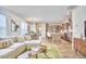 Open concept living room, kitchen and dining area with hardwood floors, modern furniture and stainless steel appliances at 1021 Greatland Rd, Durham, NC 27703