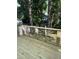 Spacious back deck, ideal for relaxing, surrounded by mature trees and a fenced yard at 103 Romaine Ct, Cary, NC 27513