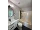 Modern bathroom with stylish vanity, round mirror, and updated shower at 103 Romaine Ct, Cary, NC 27513