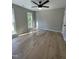 Bright bedroom featuring two bright windows, hardwood floors and neutral colors at 103 Romaine Ct, Cary, NC 27513