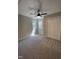 Bedroom featuring two windows, ceiling fan, closet and neutral carpet at 103 Romaine Ct, Cary, NC 27513