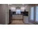 Kitchen features white cabinets, stainless steel appliances, and modern finishes at 103 Romaine Ct, Cary, NC 27513