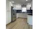 Bright kitchen features white cabinets, stainless steel appliances, and modern finishes at 103 Romaine Ct, Cary, NC 27513
