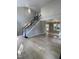 Spacious living room with hardwood floors, tall ceilings, and a carpeted staircase at 103 Romaine Ct, Cary, NC 27513