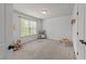 Charming bedroom with window and play accessories with neutral wall color at 104 Anderson Park Dr, Wake Forest, NC 27596